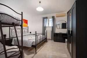 a bedroom with a bunk bed and a mirror at Oasi Torre Di Mastro, Conversano in Conversano