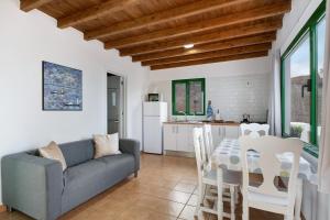 a living room with a couch and a table at San roque in Tinajo