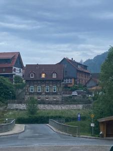 a large building with a road in front of it at Ferienhaus Rübeland in Neuwerk