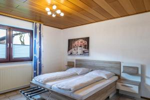 a bedroom with a bed and a window at Am Twistesee 1 Souterraint in Wetterburg