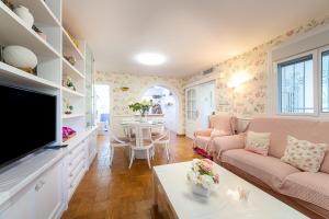a living room with a couch and a table at Cortijo Indalo in Pechina