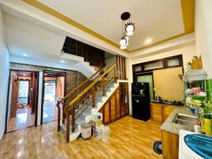a kitchen with a staircase in a house at Family Private Villa Hội An in Hoi An