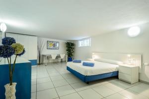 a hotel room with a bed and a desk at Can Lluc in Nuestra Señora de Jesus +20 photos