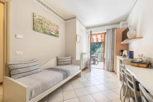 a living room with a couch and a table at Residence Tatiana A2 in Tremosine Sul Garda