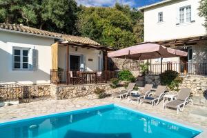 a villa with a swimming pool and a house at Afroksilia Villa Triantafilo in Lefkada