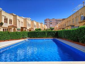 a swimming pool in the middle of a building at R-23 Modern apartment in La Mata in La Mata
