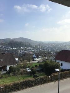 a view of a town with houses and a mountain at Balver Aussicht in Balve