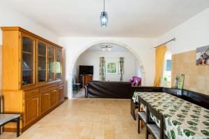 a living room with a table and a couch at Villa Grazia in Gallipoli