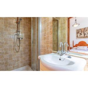 a bathroom with a sink and a shower at Casa El Retiro in Nerja