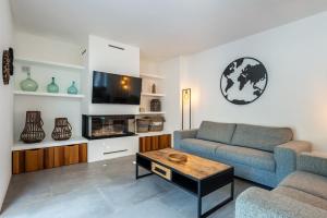 a living room with a couch and a table at Can Xumeu Ferrer in La Mola