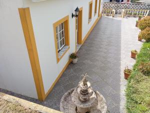 a hallway of a building with a fire hydrant at Vivenda Chã in Ribeira Funda