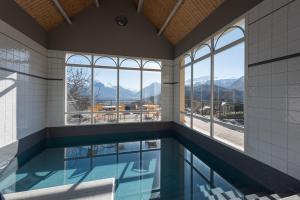 a swimming pool with a view of mountains at Gite Le Bérierot avec piscine in Ouzous