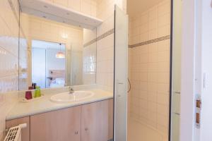 a bathroom with a sink and a mirror at Gite Le Bérierot avec piscine in Ouzous +22 photos