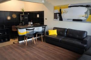 a living room with a couch and a table at Mai 'Uta Experience in Hanga Roa