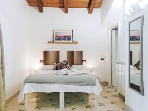 a bedroom with a bed in a white room at Holiday Home Rêve d'Or by Interhome in Citta' Sant'Angelo