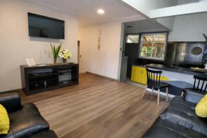 a living room with a couch and a table at Mai 'Uta Experience in Hanga Roa