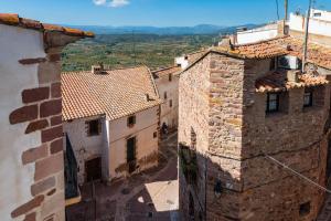 an aerial view of some buildings in a village at Casa Retiro Vilafames in Vilafamés