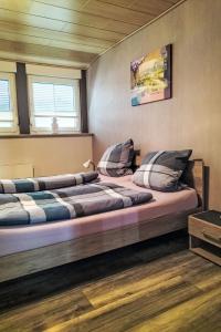 a couple of beds sitting in a room at Apartment by Interhome in Uslar