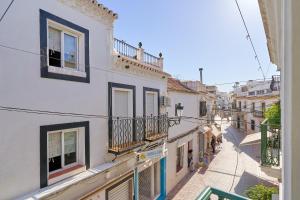 a view of an alley with buildings at Apartamento B y G Nerja in Nerja