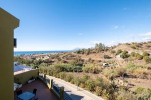 a view of the ocean from the balcony of a house at Villa Pepa in Chilches