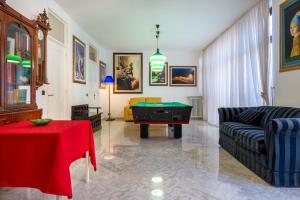 a living room with a couch and a pool table at Casa Ester in Francavilla Fontana