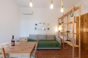 a living room with a couch and a table at Casa delle Pigne in Camporeale +18 photos