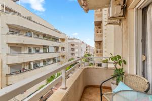 a balcony with a view of buildings at Sanpolicarpo in Torrevieja