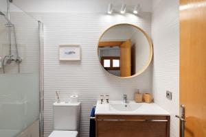 a bathroom with a sink and a mirror at La Mariana in Punta Mujeres