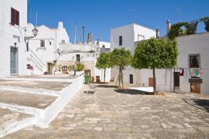 a street in a town with white buildings at Suite Carlomaria in Ceglie in Ceglie Messapica