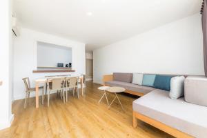 a living room with a couch and a table at Apartament Massanet 2a in Canyamel