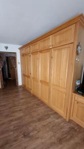 a row of wooden cabinets in a room at Ferienwohnung Älple im Sonnenpark in Bad Hindelang