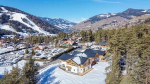 an aerial view of a ski resort in the mountains at Les Ciases Chalets Dolomites Apt 4 in San Vigilio Di Marebbe