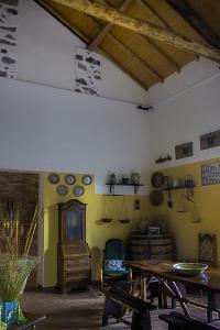 a room with a table and chairs and plates on the wall at Il Limoneto Acireale in Acireale +57 photos