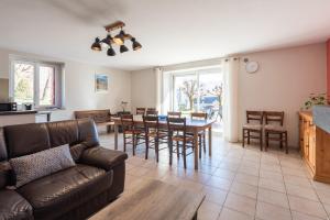 a living room with a couch and a table at Gite d'Ayzi in Ouzous
