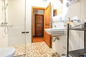a bathroom with a sink and a toilet and a mirror at Ferienhof Hohe in Hiltpoltstein +21 photos