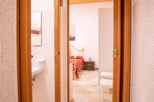 a room with a bed and a bathroom at B&B Pedruzza in Alghero +28 photos