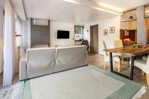 a living room with a couch and a table at Fewo Luzia in Schönwald