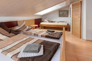 a room with two beds and a couch in it at Haus Schwanenweg in Konstanz