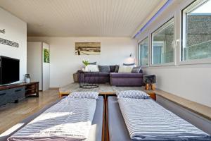 a living room with two beds and a couch at Chilli Home in Tettnang