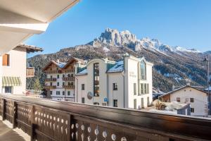 a view from the balcony of a hotel with a mountain at Ciasa De Marugiana in Gardeccia - San Giovanni di Fassa