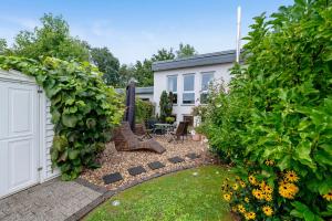 a backyard with a white fence and a garden at Bei Annemarie in Trier