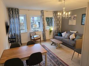 a living room with a couch and a table at Bei Annemarie in Trier