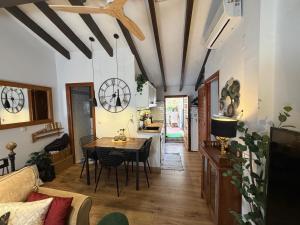a living room with a table and a dining room at Casa Trinidad in Denia