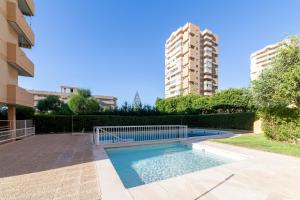 a swimming pool in the middle of a building at Apartamento Calle Ciruelo in Aguadulce