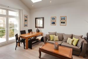a living room with a couch and a table at Appartement Halbinsel Wittow in Binz