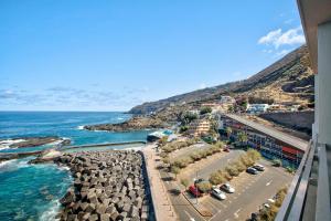 a view of the ocean from a building at Salitre Suites Tamara in Tacoronte