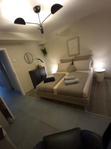 a bedroom with a large bed with pillows at moselquartier terlinden- Apartment in Besch