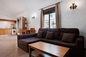 a living room with a couch and a table at Villa Perez Zara 1 in Campano
