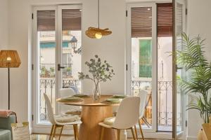 a dining room with a table and chairs at El Mirador de Neptuno in Priego de Córdoba +14 photos