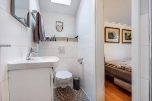a small bathroom with a sink and a toilet at Alter Laden in Nienstädt